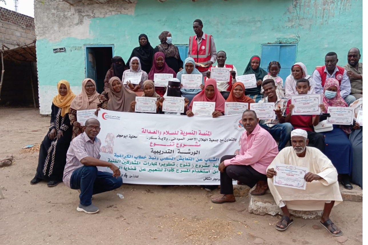 Participants holding certificates at the close of a joint training with partner staff